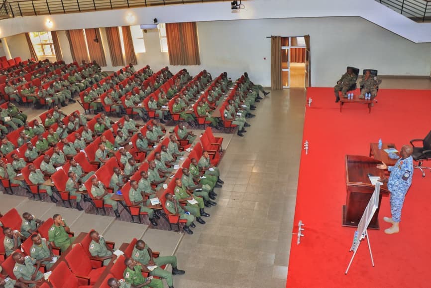 Officer cadets listening to Lt Gen Okidi